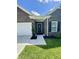 Charming front entrance featuring a stylish black door with wreath, black shutters, and fresh landscaping at 1119 E Main Cross St, Edinburgh, IN 46124