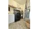 Well-organized laundry room with modern washer, freezer, and shelving for storage solutions at 1119 E Main Cross St, Edinburgh, IN 46124