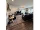 An open-concept living room featuring hardwood floors, comfortable seating, and a large flat-screen TV at 1119 E Main Cross St, Edinburgh, IN 46124