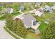 Aerial view of a home featuring a large backyard with patio, a covered lounge area, and mature trees within a charming neighborhood at 11205 Echo Ridge Ln, Indianapolis, IN 46236