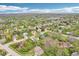 Expansive aerial view of a residential area showcasing numerous houses and lush green trees at 11205 Echo Ridge Ln, Indianapolis, IN 46236