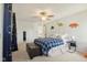 Cozy bedroom featuring a plaid comforter, leather ottoman, and charming decor at 11205 Echo Ridge Ln, Indianapolis, IN 46236