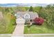 Aerial view of home featuring a two-car garage, mature landscaping, and a well-maintained lawn at 11205 Echo Ridge Ln, Indianapolis, IN 46236
