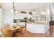 Bright kitchen features white cabinets, stainless steel appliances, and granite countertops, perfect for cooking and entertaining at 11205 Echo Ridge Ln, Indianapolis, IN 46236