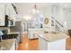 Modern kitchen featuring granite countertops, stainless steel appliances, and an open layout, perfect for cooking and entertaining at 11205 Echo Ridge Ln, Indianapolis, IN 46236