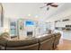 Cozy living room with a fireplace, built-in shelving, and a comfortable sofa, creating a perfect space for relaxation and entertainment at 11205 Echo Ridge Ln, Indianapolis, IN 46236