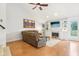 Bright living room with a fireplace, a cozy seating area, and large windows, creating a warm and inviting atmosphere at 11205 Echo Ridge Ln, Indianapolis, IN 46236