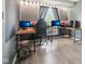 Bright office space with a modern desk setup, multiple monitors, and comfortable ergonomic chair at 11205 Echo Ridge Ln, Indianapolis, IN 46236