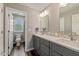 Bright bathroom with a double sink vanity and a toilet in a separate room at 11469 Burkwood Dr, Carmel, IN 46033