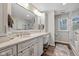 Elegant bathroom features a large vanity, modern fixtures, and a luxurious shower at 11469 Burkwood Dr, Carmel, IN 46033