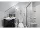Bathroom featuring a glass shower, dark vanity, and a mirror at 11469 Burkwood Dr, Carmel, IN 46033