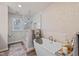 Beautiful bathroom featuring a modern tub, glass shower, and elegant fixtures at 11469 Burkwood Dr, Carmel, IN 46033