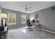 Neutral bedroom offering lots of light, a ceiling fan, and carpeted floors at 11469 Burkwood Dr, Carmel, IN 46033