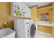 Functional laundry room with modern appliances, ample storage, and bright lighting at 11469 Burkwood Dr, Carmel, IN 46033