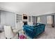 Spacious living room with built-in shelves and fireplace, with a comfortable blue sofa at 11469 Burkwood Dr, Carmel, IN 46033