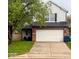 Charming two-story home with a brick facade, two-car garage, and well-maintained lawn at 11651 Congressional Ln, Indianapolis, IN 46235