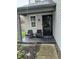 Cozy front porch featuring two chairs and a black-framed door, perfect for relaxing at 11651 Congressional Ln, Indianapolis, IN 46235