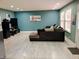 Spacious living room featuring a comfortable sectional sofa and bright, natural lighting at 11651 Congressional Ln, Indianapolis, IN 46235