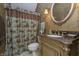 Bathroom with unique vanity, toilet and shower with designer shower curtain at 11697 Whisper Bay Ct, Carmel, IN 46033