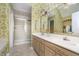Well-lit bathroom with double sinks, a large mirror, and glass enclosed shower at 11697 Whisper Bay Ct, Carmel, IN 46033