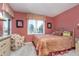 Cozy bedroom with soft carpet, natural light, and a comfortable chair at 11697 Whisper Bay Ct, Carmel, IN 46033