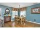Charming dining room with a chandelier, wood floors, and window lighting at 11697 Whisper Bay Ct, Carmel, IN 46033