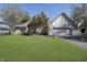 Charming single-story brick home with a well-manicured lawn and a neatly landscaped front yard at 11697 Whisper Bay Ct, Carmel, IN 46033