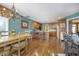 Open concept kitchen and dining area featuring a center island and ample seating at 11697 Whisper Bay Ct, Carmel, IN 46033