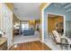 Open-concept living room with hardwood floors, blue accent walls, and neutral furnishings at 11697 Whisper Bay Ct, Carmel, IN 46033