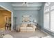 Cozy living room featuring neutral color palette, chair rail, and large window with shutters at 11697 Whisper Bay Ct, Carmel, IN 46033