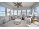 Bright sunroom with lots of windows and comfortable seating, perfect for relaxing at 11697 Whisper Bay Ct, Carmel, IN 46033