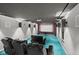 Finished basement home theater with tiered seating and surround sound speakers at 11780 Pebblepointe Pass, Carmel, IN 46033