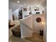 Upstairs landing area with neutral decor and a cozy sitting area at 12043 N Berling Dr, Mooresville, IN 46158