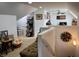 Upstairs landing area with neutral decor and a cozy sitting area at 12043 N Berling Dr, Mooresville, IN 46158