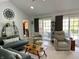 Inviting living room with vaulted ceilings, recessed lighting, and neutral decor, creating a cozy and stylish space at 12043 N Berling Dr, Mooresville, IN 46158