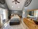 Spacious bedroom with vaulted ceiling, features a king bed, bench, and dresser with large decorative mirror at 12043 N Berling Dr, Mooresville, IN 46158