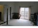 Bright bedroom with sliding glass doors to deck, neutral carpet, and a traditional wood bed frame at 121 Lake Hart, Mooresville, IN 46158