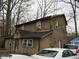 Two-story home showcasing windows, a front entrance, and adjacent parked cars at 121 Lake Hart, Mooresville, IN 46158