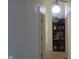 Well-lit hallway with a built-in bookshelf and a view of a window with lots of natural light at 121 Lake Hart, Mooresville, IN 46158