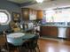 Cozy kitchen with wooden cabinets, unique windows, and lots of natural light at 121 Lake Hart, Mooresville, IN 46158