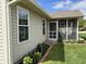 The exterior shows a well-maintained backyard with a screened-in porch and attractive landscaping at 1316 Long Shore Dr, Indianapolis, IN 46217