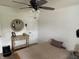 Bedroom featuring wood floors, ceiling fan, and side table at 1316 Long Shore Dr, Indianapolis, IN 46217