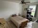 Cozy bedroom with wood floors, ceiling fan, and natural light at 1316 Long Shore Dr, Indianapolis, IN 46217