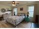 Comfortable bedroom with wood floors, bright windows, and tasteful decor at 1316 Long Shore Dr, Indianapolis, IN 46217