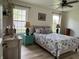 Inviting bedroom with wood floors, bright windows, and fresh decor at 1316 Long Shore Dr, Indianapolis, IN 46217