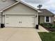A well-kept garage with modern doors enhances the curb appeal of this attractive home at 1316 Long Shore Dr, Indianapolis, IN 46217