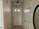 Bright hallway featuring wood-look flooring, white trim, and a modern light fixture that welcomes you inside at 1316 Long Shore Dr, Indianapolis, IN 46217