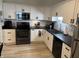Modern kitchen featuring stainless steel appliances and white cabinets at 1316 Long Shore Dr, Indianapolis, IN 46217