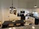 Bright kitchen features white cabinets, stainless steel appliances and dining area at 1316 Long Shore Dr, Indianapolis, IN 46217