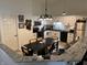 Open kitchen with stainless steel appliances, white cabinets and adjacent dining area at 1316 Long Shore Dr, Indianapolis, IN 46217
